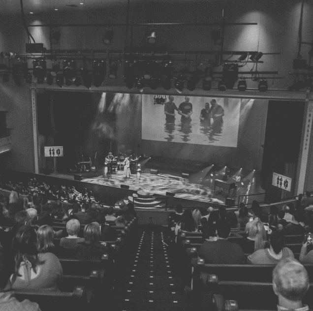 Worship service at Rolling Hills Community Church with congregation and stage.